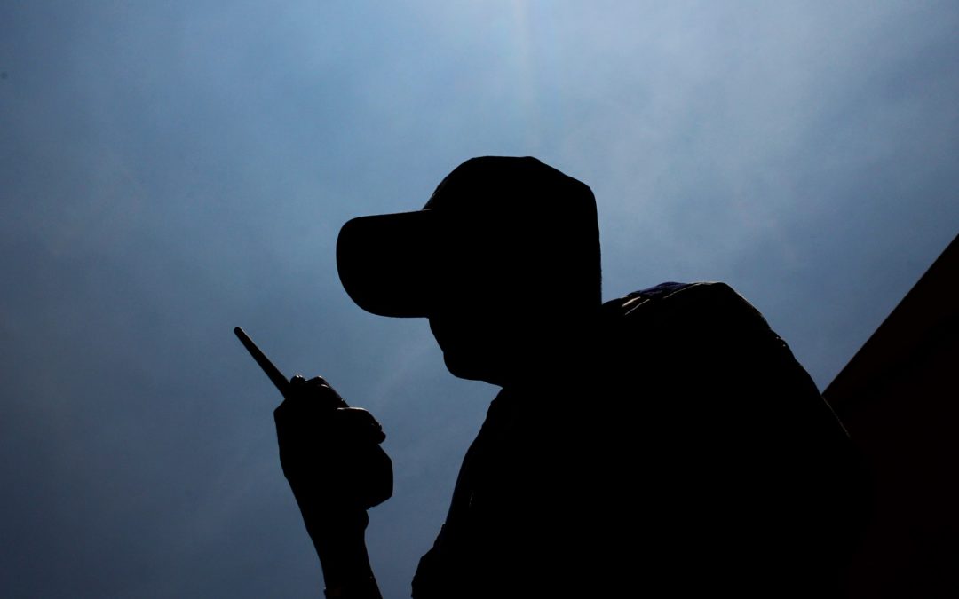 silhouette of a security guard on patrol